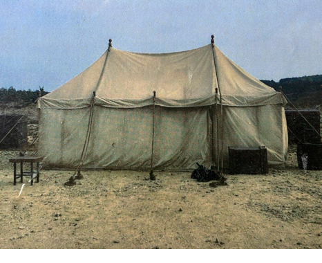 A set of large sand-coloured marquee tents/ vintage Army camp style. An entrance can be set anywhere around the edge.