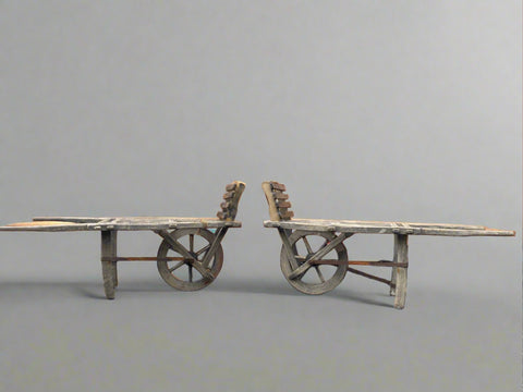 A pair of 19th century hay wheelbarrow carts/ railway porters luggage carts.