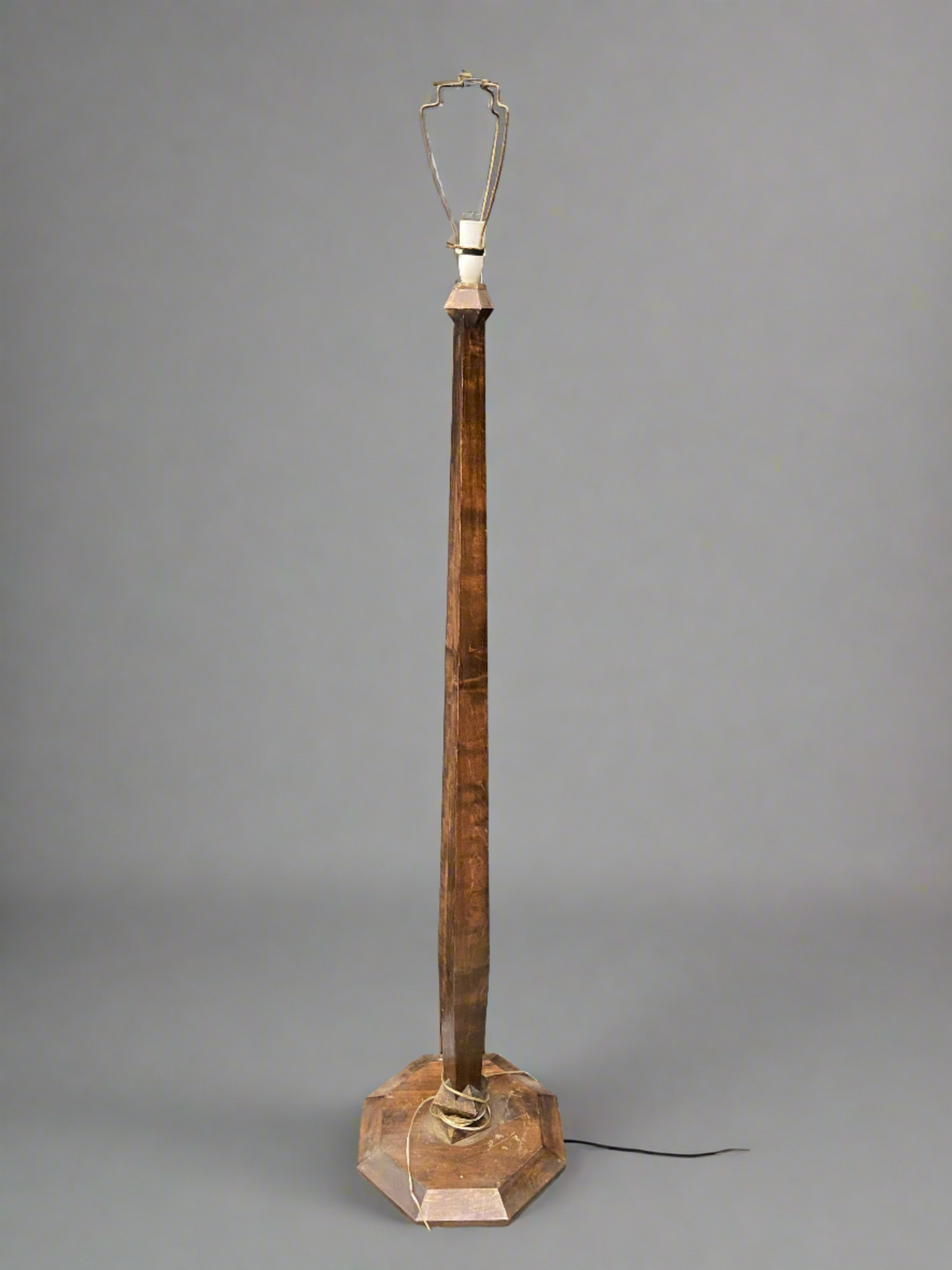 Floor standing oak lamp with an octagonal base, circa 1930s.