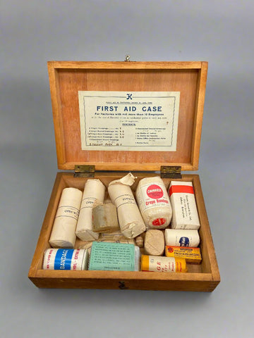 Wooden first aid box filled with medical supplies, circa 1938.