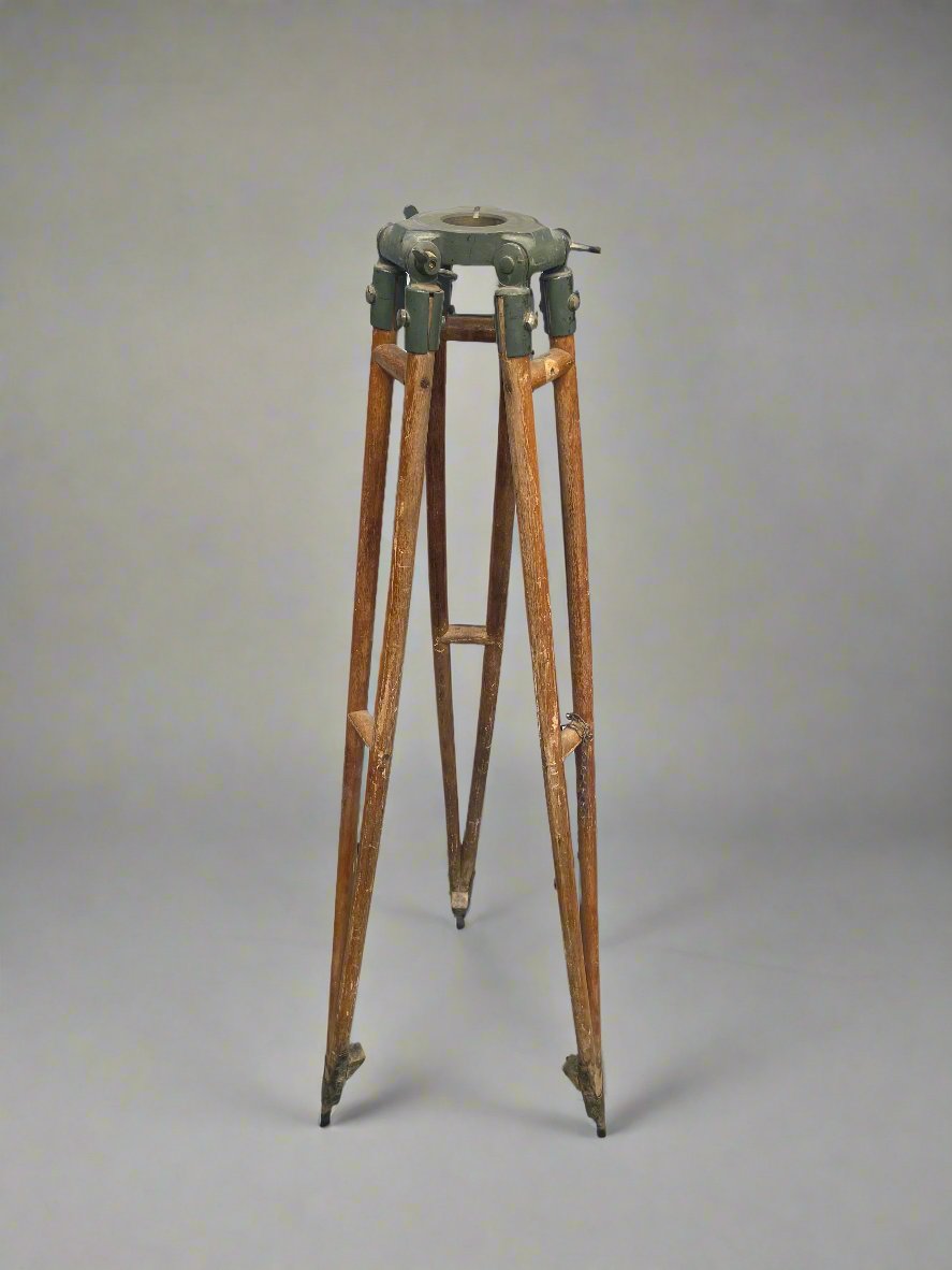 Vintage wooden surveyor's tripod.