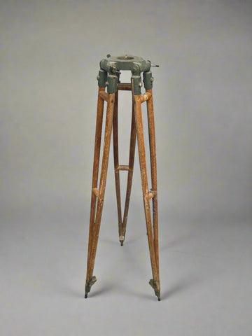 Vintage wooden surveyor's tripod.
