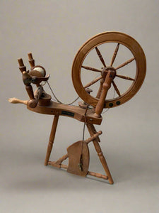 Traditional wooden spinning wheel by Frank Herring Sons.