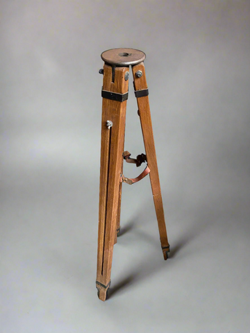 A set of large matching wooden tripods.