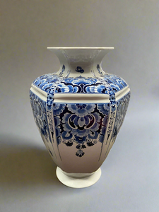 Traditional Dutch blue and white vase by Delft. Hand painted with a floral design.