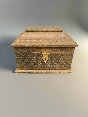 Trio of gold nesting boxes covered with star and spotted patterns.