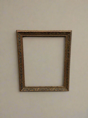 Victorian rectangular gold picture frame with an ornate repeating pattern.