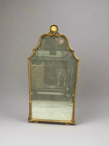 French style gold mirror with decorative rope patterned frame and large shell top.