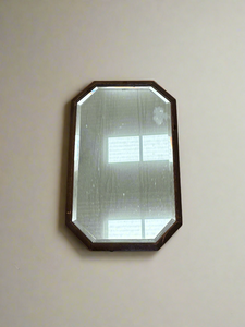 Antique octagonal bevelled wall mirror.