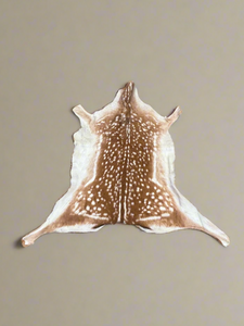 A set of fallow deer hide rugs.