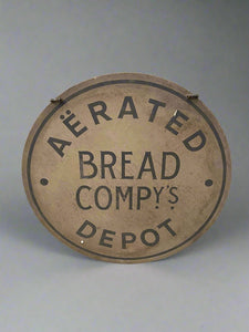 Round 'Aerated Bread Company's Depot' wooden wall sign.