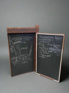 Large hinged wooden blackboard which can be mounted on a wall.