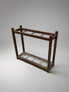 Simple rectangular wooden stick and umbrella stand.