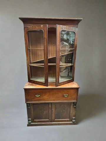 Antique wooden display cabinet with a large drawer with brass handles.