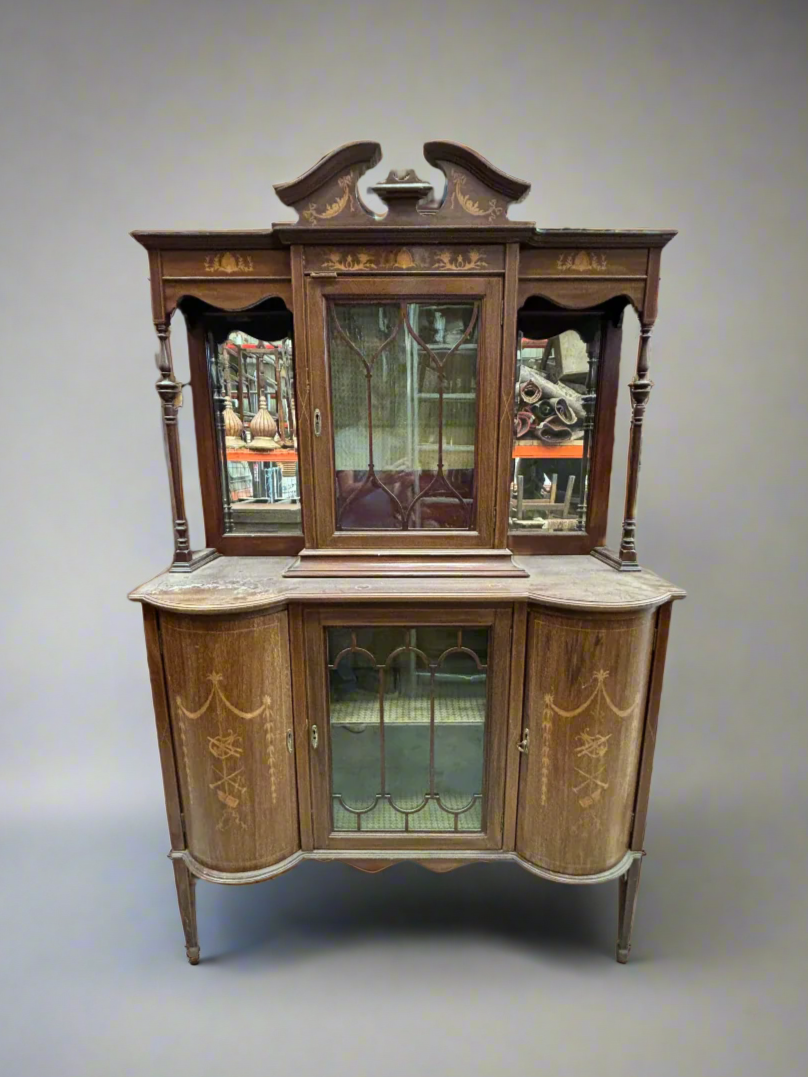 Antique Victorian inlaid mahogany display cabinet with mirrored panels.