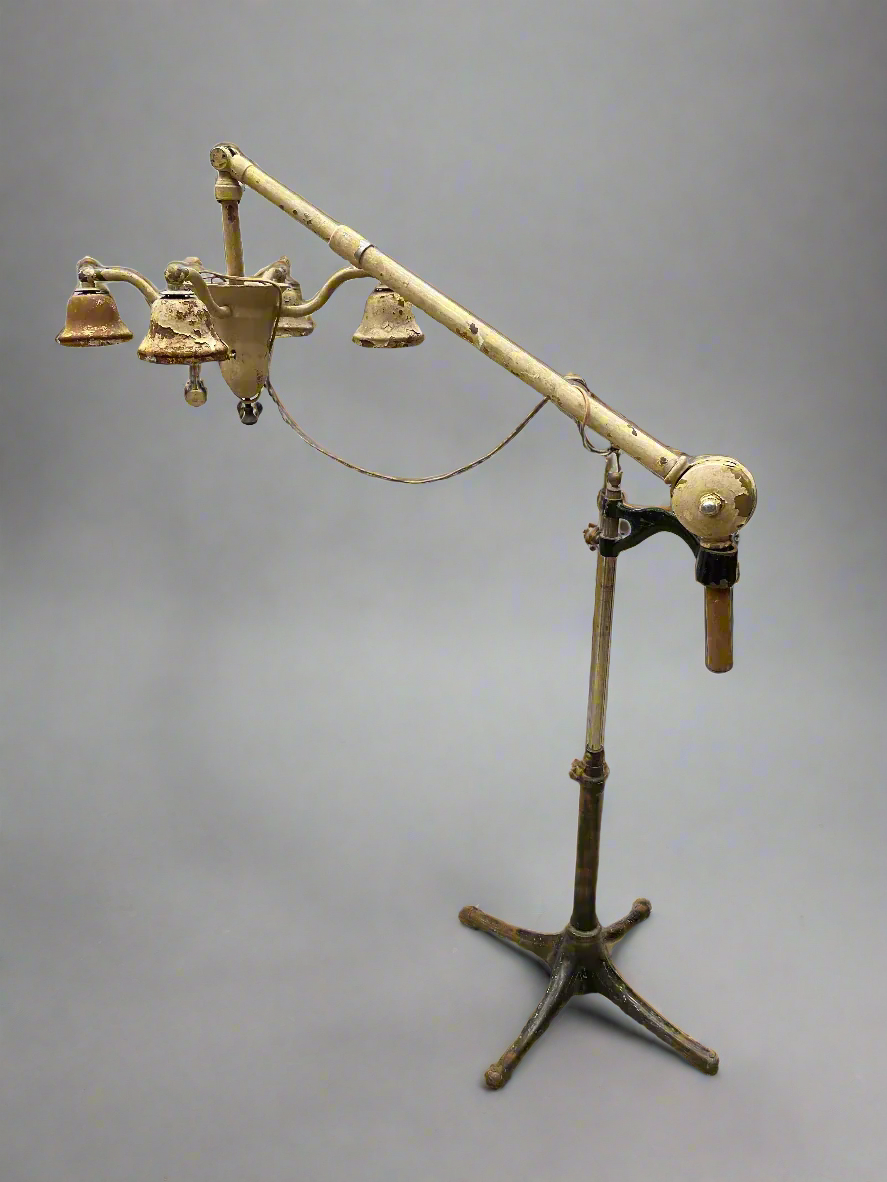 Vintage cream dental lamp station, circa mid 20th century. In an aged condition.