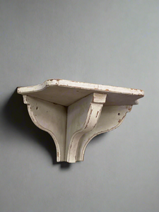 A single rustic cream corbel shelf.