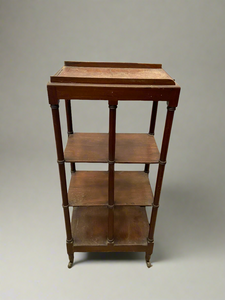 Antique mahogany open shelf storage unit on castors.