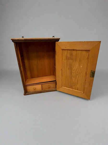 Oak kitchen wall cabinet with ribbed beading.