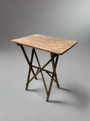 Rustic country folding table with an oak top.