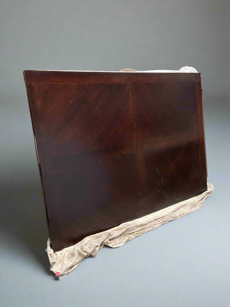 A huge, antique, rectangular, wooden dining table with heavily turned legs.