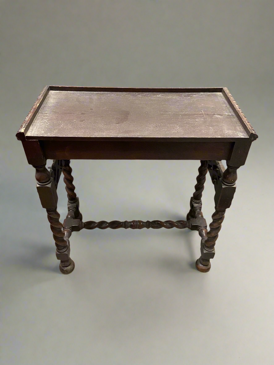 Rectangular topped wooden side table with barley twist legs.