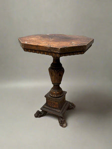 Italian octagonal wooden pedestal table with lion paw feet, circa early 19th century.