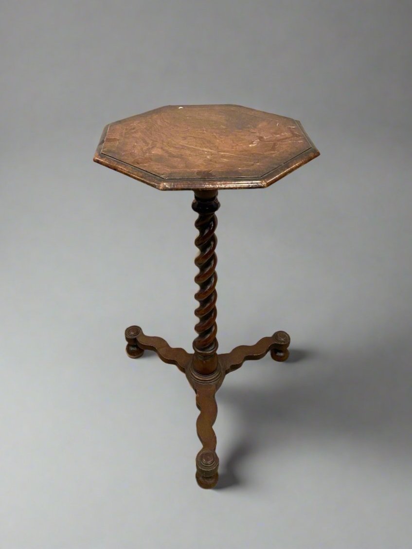 Octagonal Victorian side table with a turned barley twist stem.