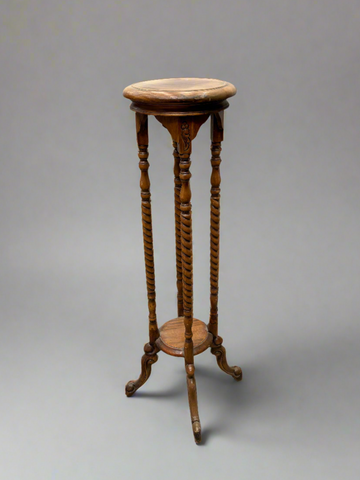 A matching trio of Victorian plant stand jardinieres with tall barley twist legs.