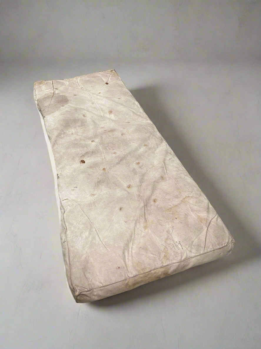 Old vintage single mattress in a stained condition.