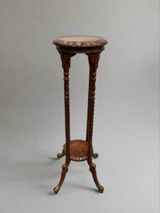 A matching set of mahogany torchieres/ plant stands with barley twist legs.