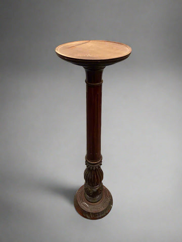 Victorian mahogany torchiere with a thick carved stem.