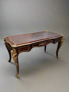 French Louis XVI style writing desk, circa 1880s. An ornate, baroque, presidential style piece with ormolu decorated details.