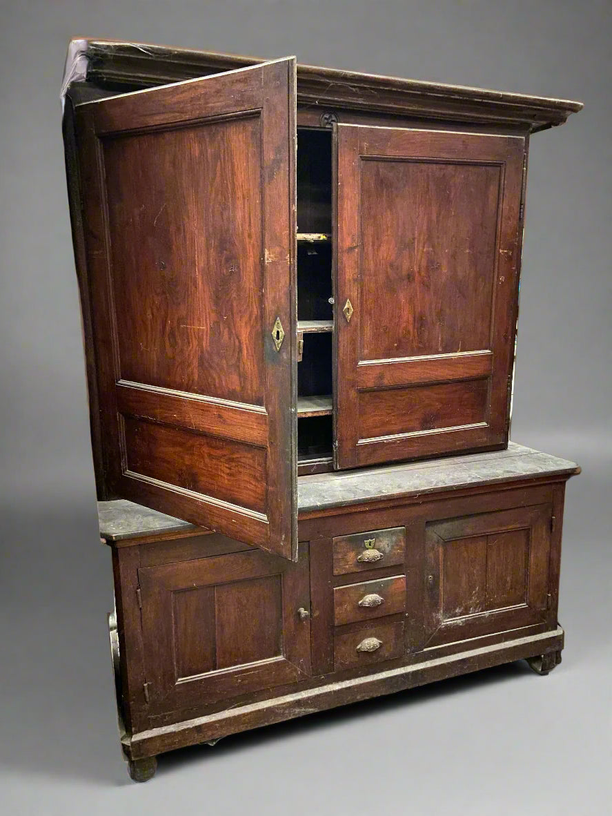 Antique wide housekeepers cupboard with brass hardware.