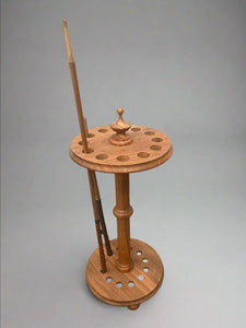 Circular wooden snooker and pool cue stand.