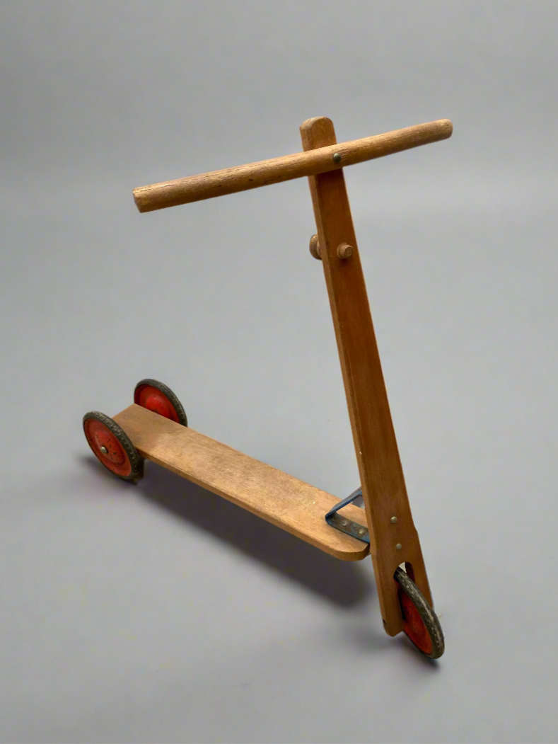 Child's wooden pedal scooter, circa 1960s.