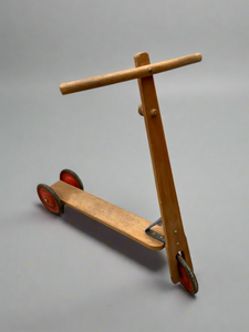 Child's wooden pedal scooter, circa 1960s.
