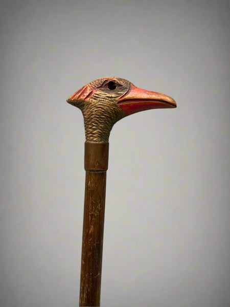 Gentleman's walking stick with a carved wooden duck head handle.