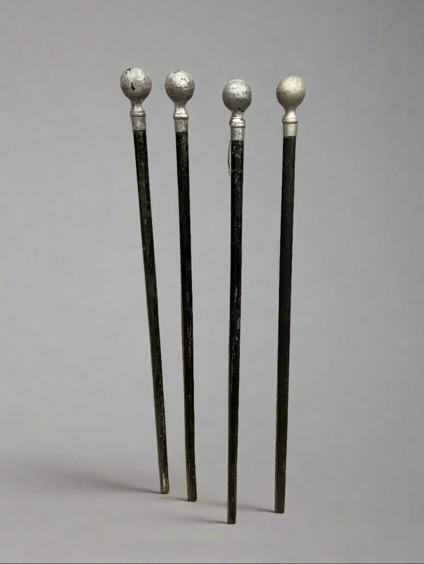 A collection of black walking sticks with silver pommel tops. We have one 'hard' original and four softs (one is not shown in the photograph.)