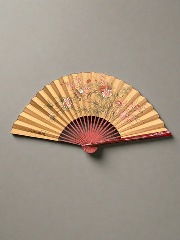 A traditional Asian folding paper fan, with a hand-painted chinoiserie style design.