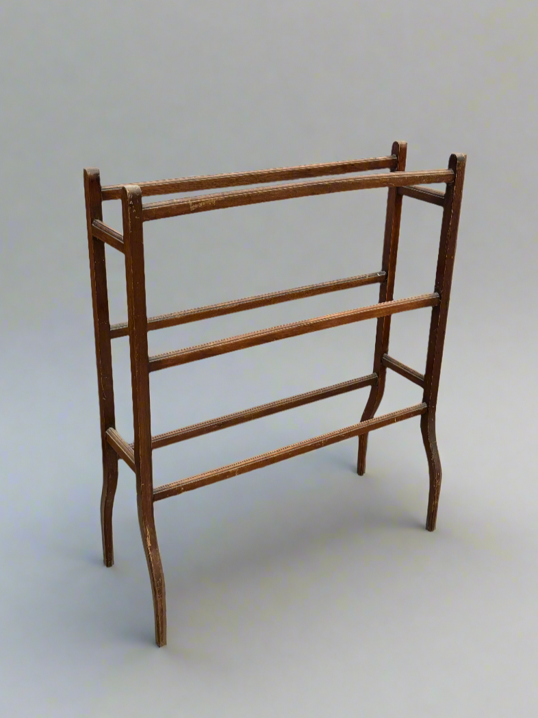 An Edwardian mahogany towel rail, with a simple design.