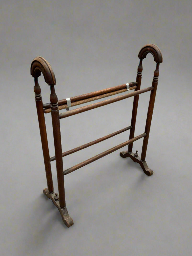 A freestanding Victorian mahogany towel rail.