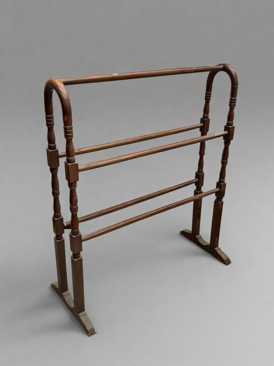 Victorian mahogany towel rail with a curved frame, circa 1800s.