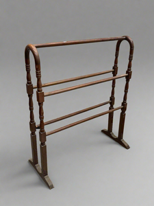 Victorian mahogany towel rail with a curved frame, circa 1800s.