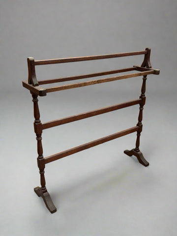 Edwardian turned towel rail with a T-shaped frame.