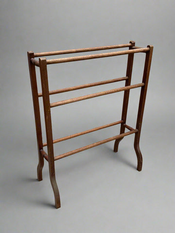 Edwardian wooden towel rail with a boxed frame.