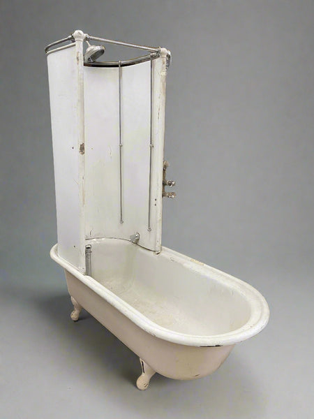 Victorian, white, cast-iron canopy bath/shower on raised legs.