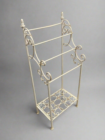 A matching pair of vintage, French, provincial-style towel racks.