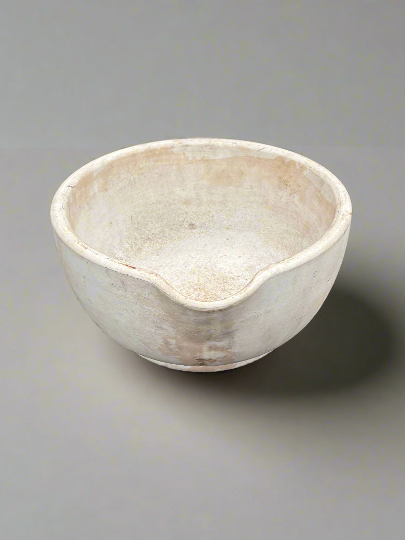 Extra large primitive ceramic mortar and pestle bowl with a natural finish.