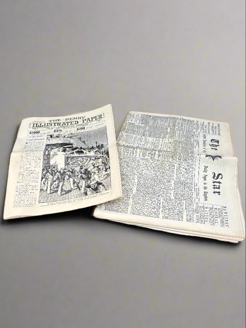 A stack of 'graphic prop-make' Victorian newspapers.